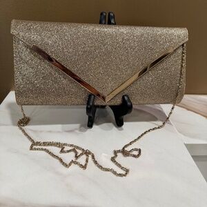 SPRING gold metallic clutch with strap, excellent condition